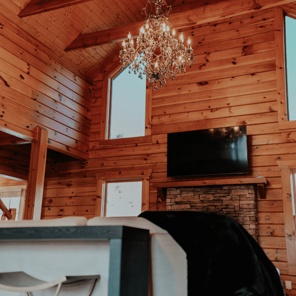 Upstairs loft room with chandelier and wooden beams in bride’s suite at Grahams Estate Gallatin TN