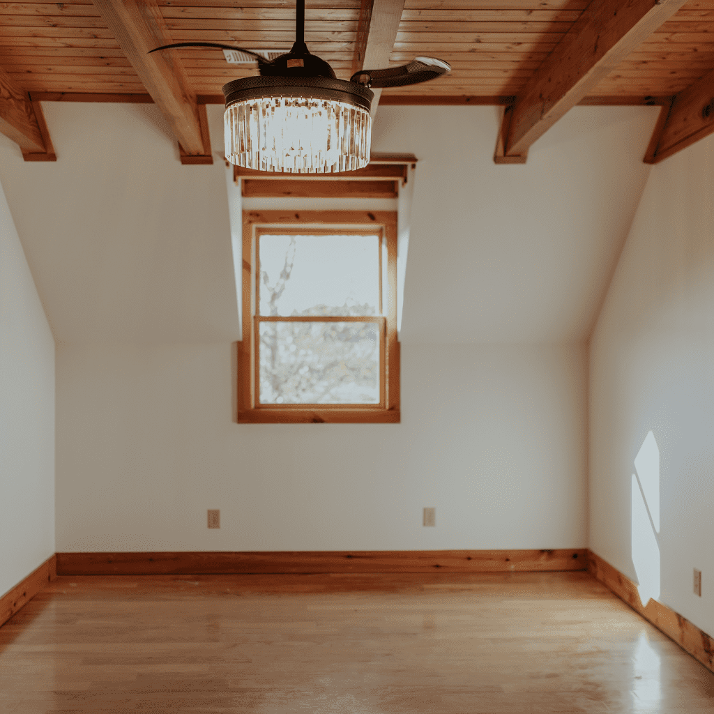 Sunlight through wooden loft window in bride’s suite at Grahams Estate Gallatin TN