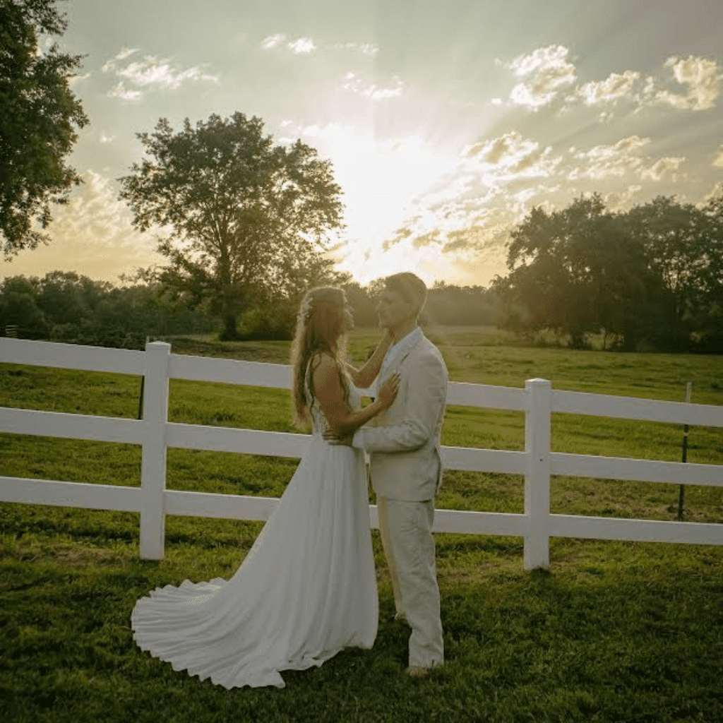 Bride and groom kiss during sunset at Grahams Estate Gallatin
