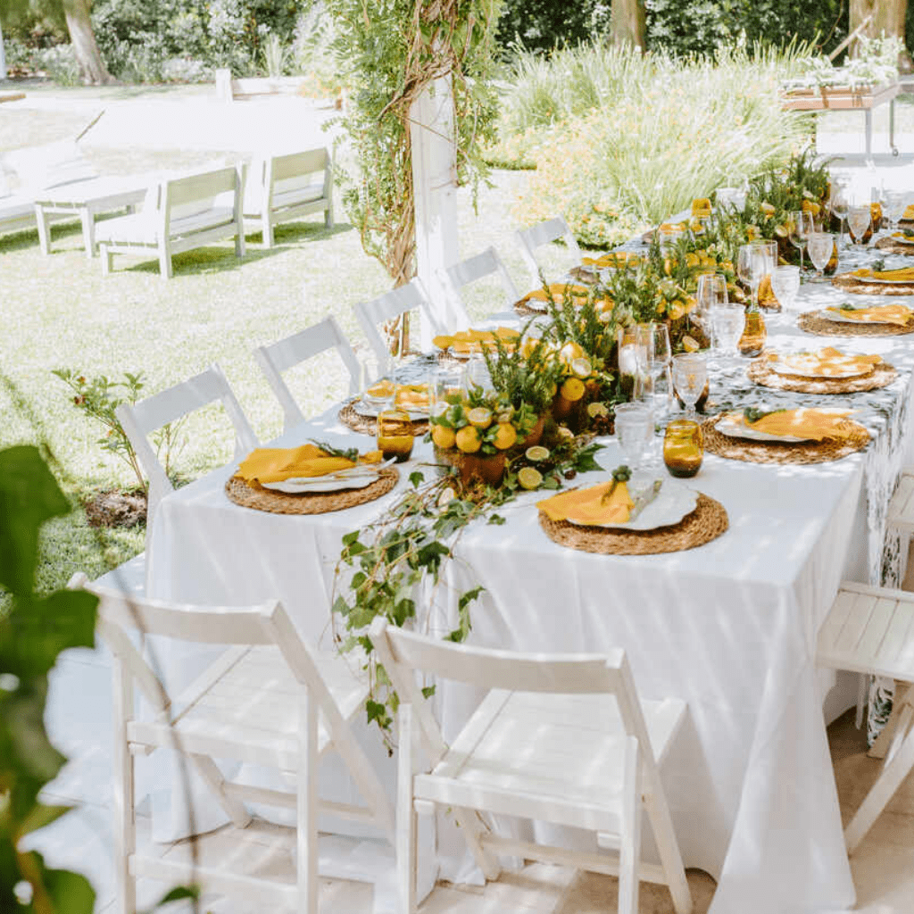 Outdoor wedding table decorated with lemons and greenery at Grahams Estate Gallatin TN