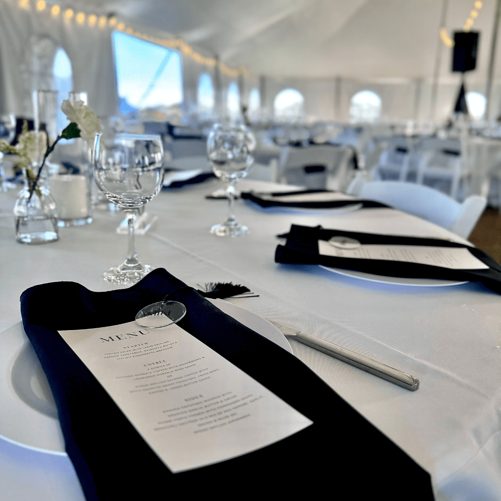 Elegant wedding table with menu cards and black napkins at Grahams Estate Gallatin TN