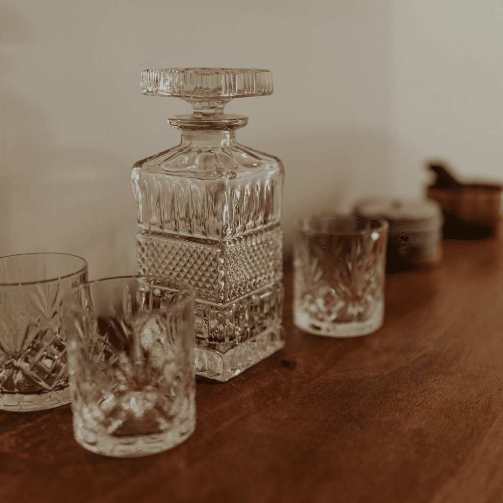Crystal whiskey decanter and glasses in groom’s gallery at Grahams Estate Gallatin TN