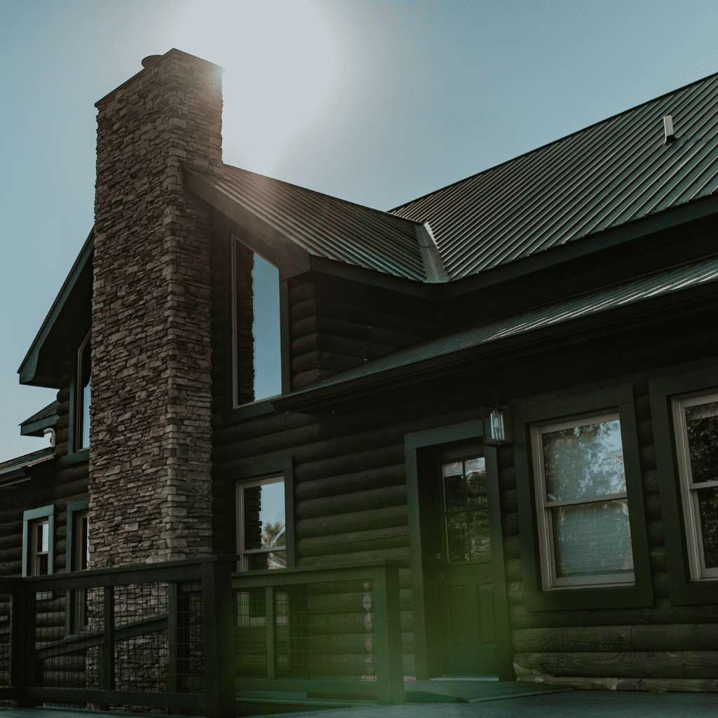 Sunlight over stone chimney and wood cabin bride’s suite at Grahams Estate Nashville TN