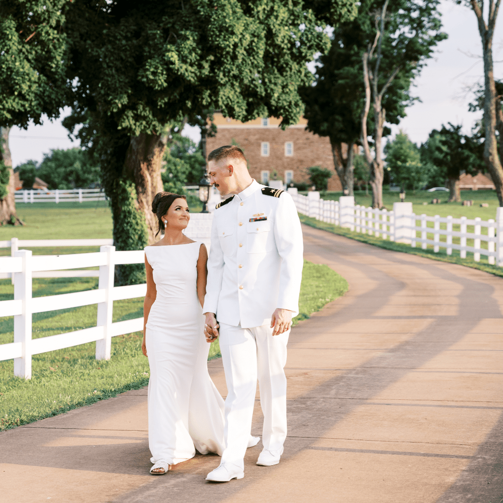 Bride and groom walking hand in hand on driveway at Grahams Estate Gallatin TN