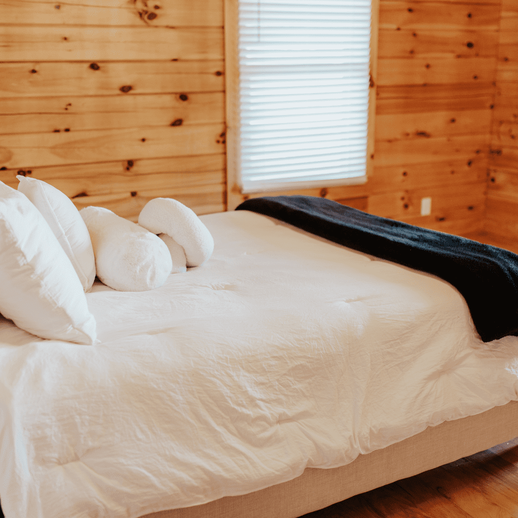 Loft bedroom with wood trim and natural light in bride’s suite at Grahams Estate Gallatin TN