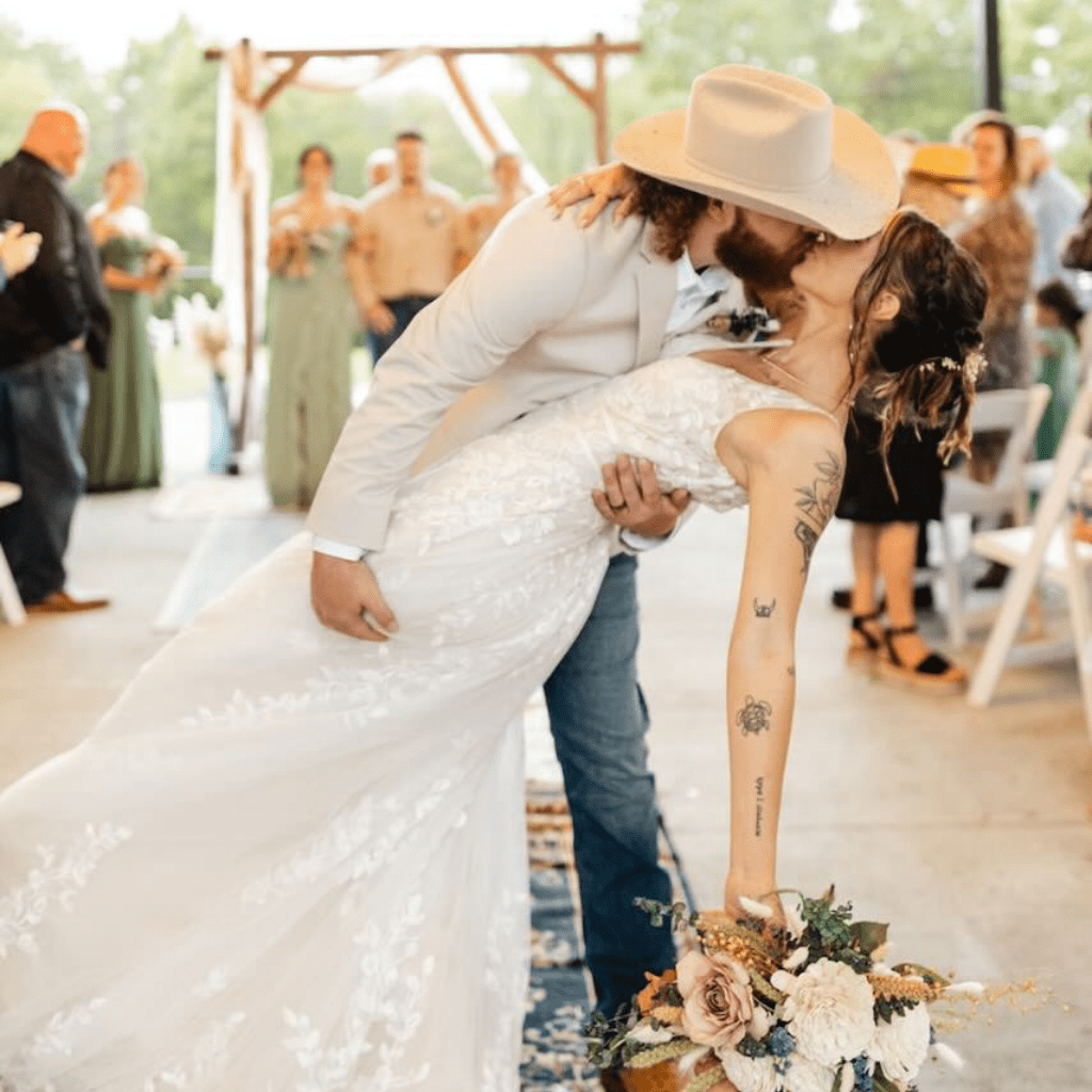 Bride and groom share a kiss at Gallatin wedding venue