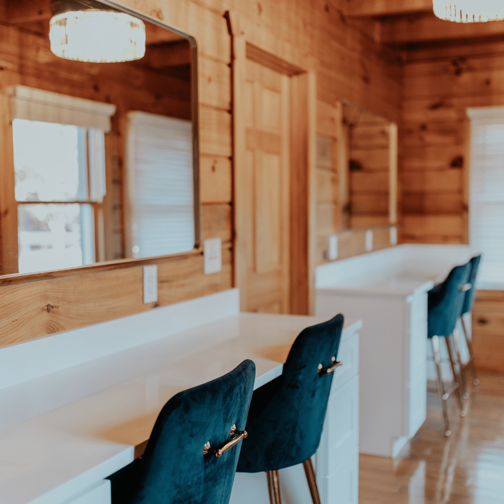 Bride’s suite vanity stations with velvet chairs and mirrors at Grahams Estate Gallatin TN