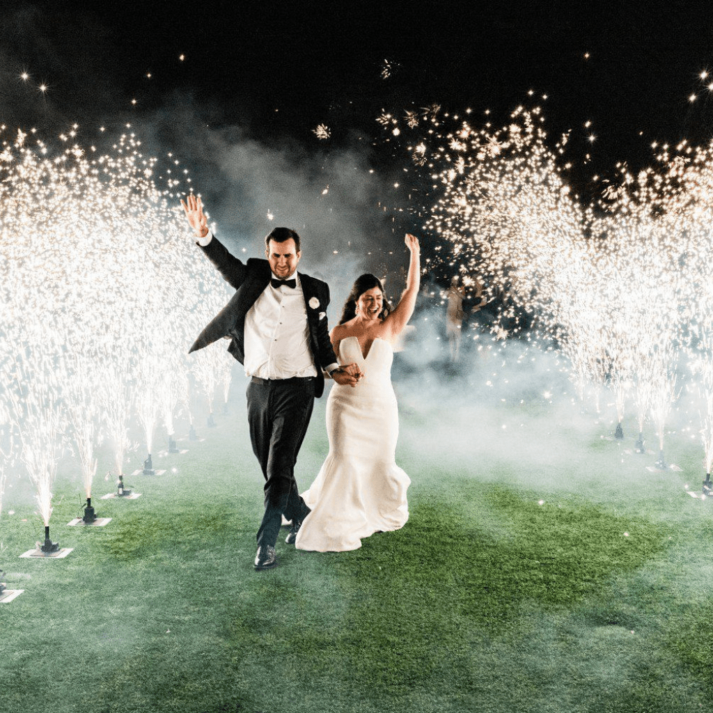 Bride and groom walk through fireworks at Gallatin wedding