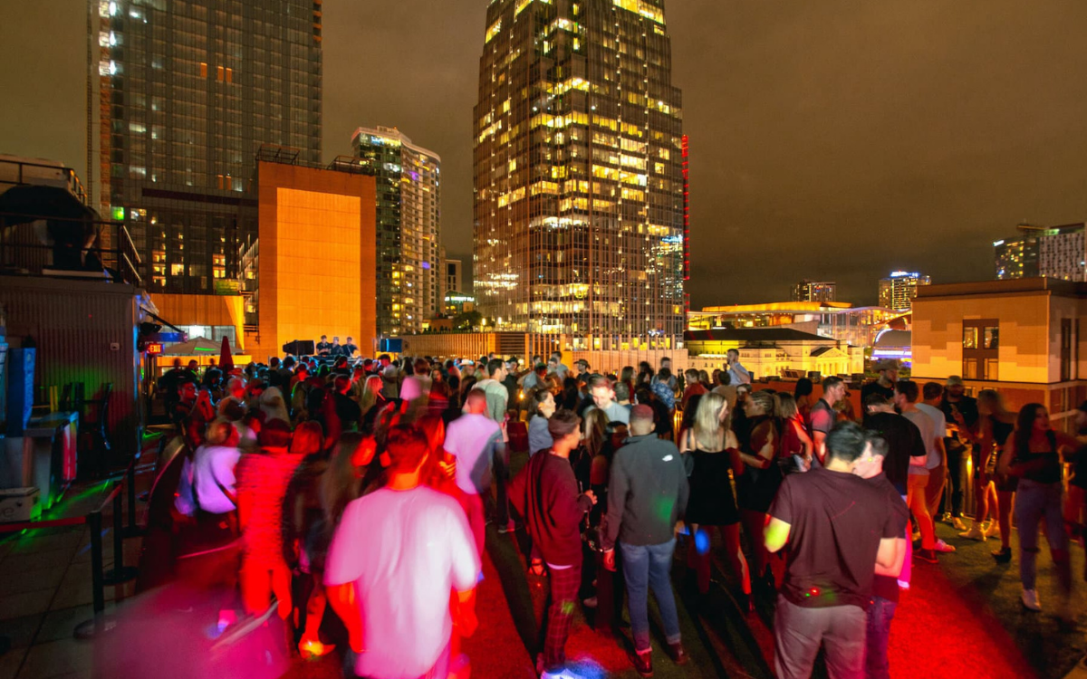 Rooftop bar overlooking Broadway in Nashville on a summer night