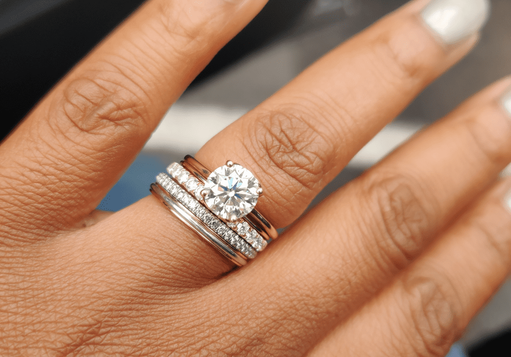 Different engagement ring metal bands stacked together