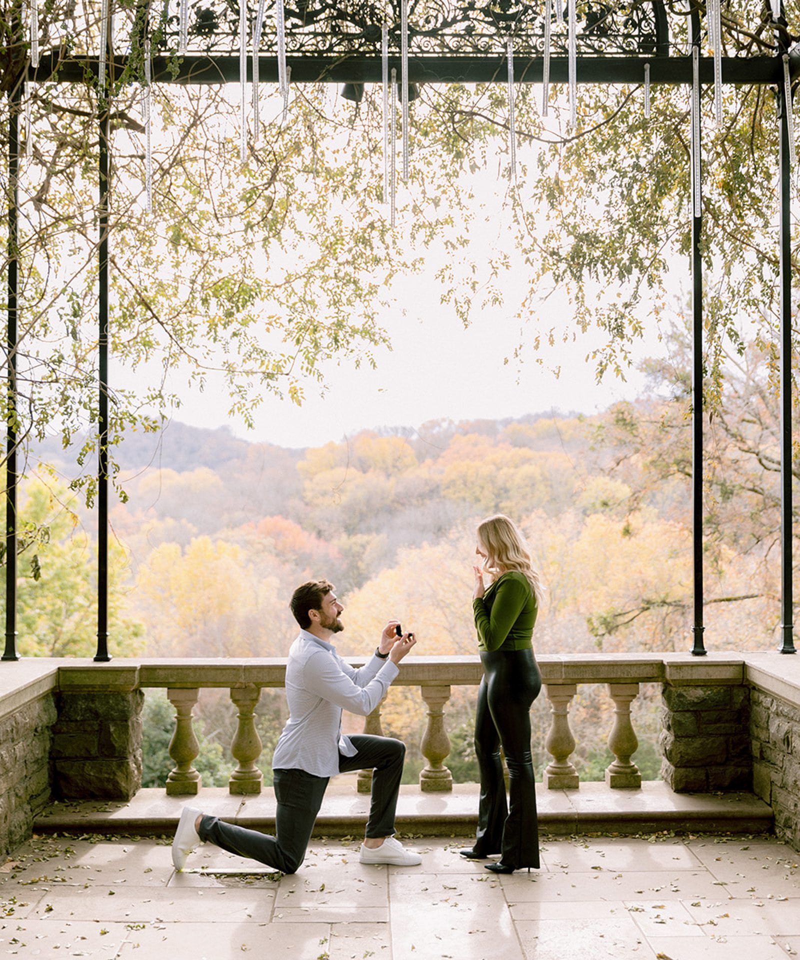 Couple walking through Cheekwood Estate and Gardens surrounded by flowers
