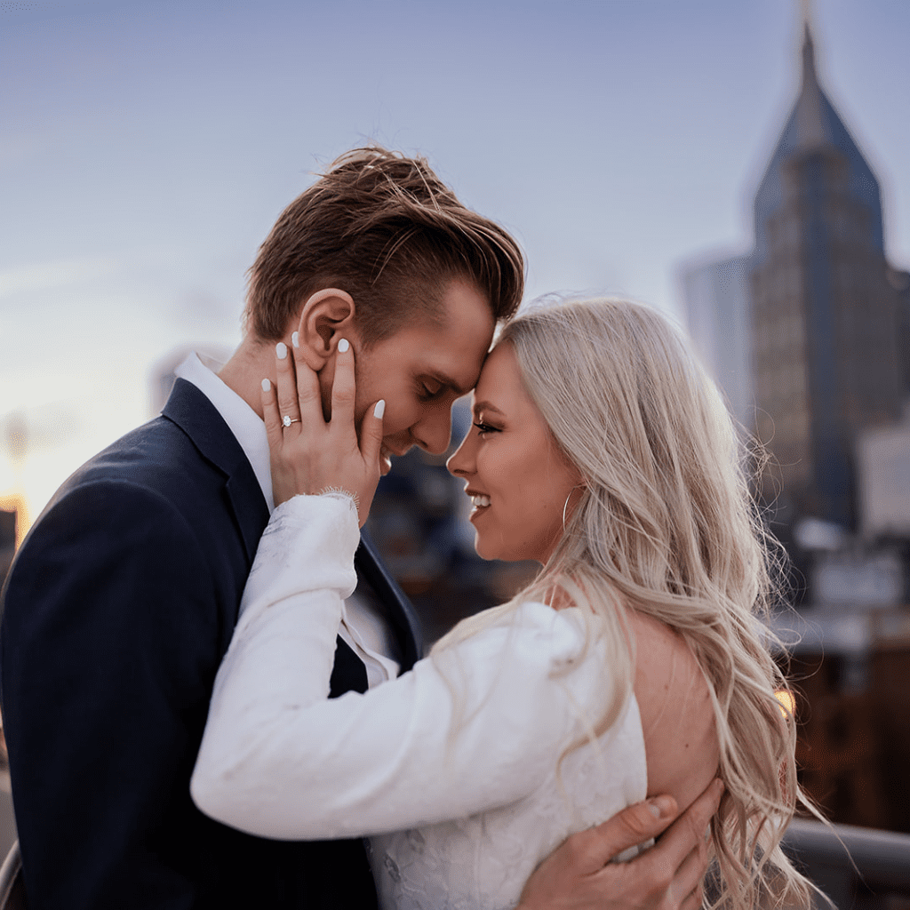 Engagement photos on the Nashville pedestrian bridge overlooking Cumberland Park