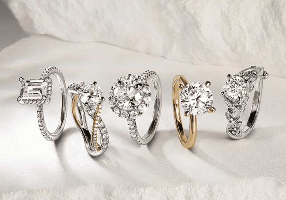 Multiple engagement ring settings displayed together on a tray