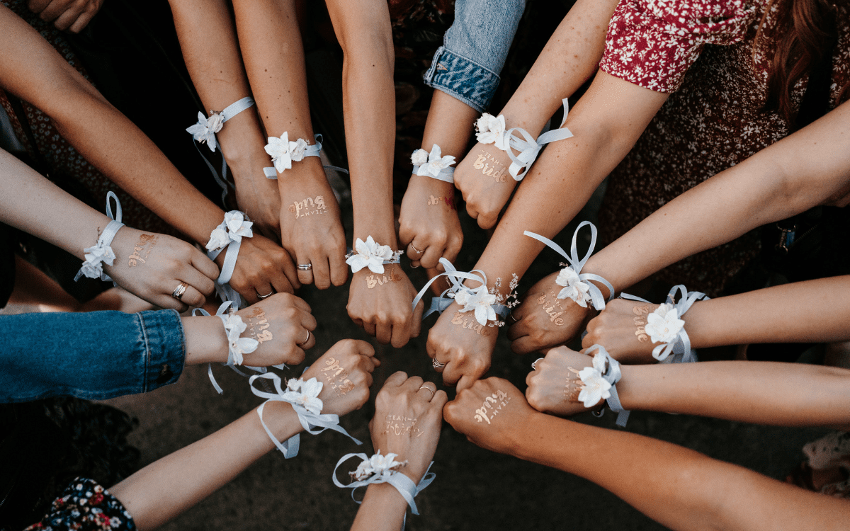 Bachelorette planning scene with champagne and notebooks