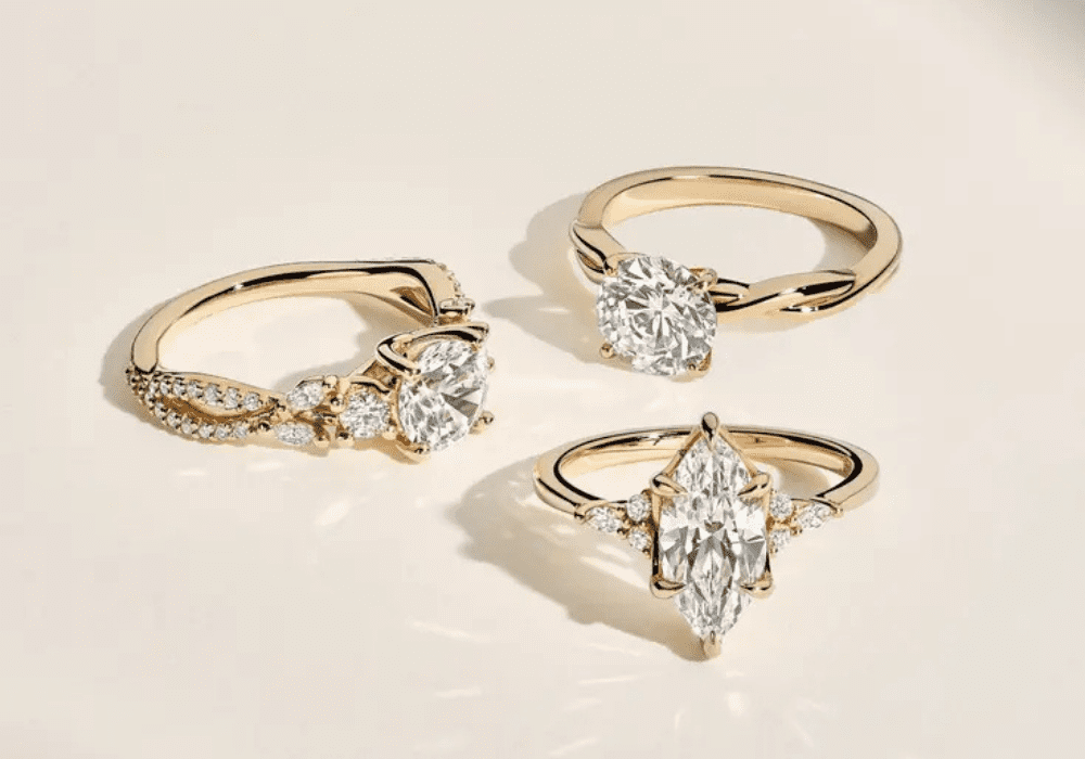 Assorted engagement ring styles displayed on a neutral background