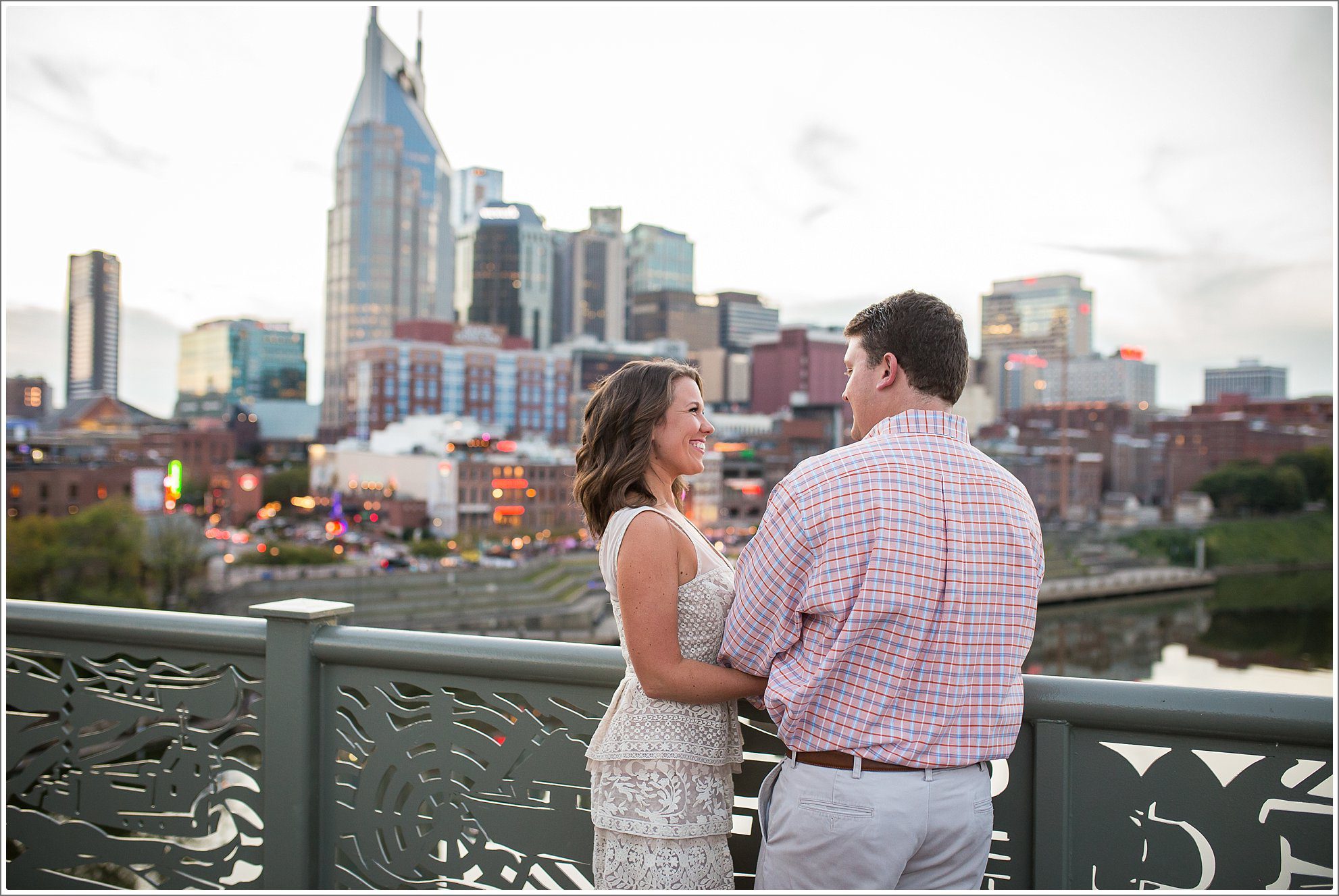 Engagement photos with Nashville skyline from Cumberland Park