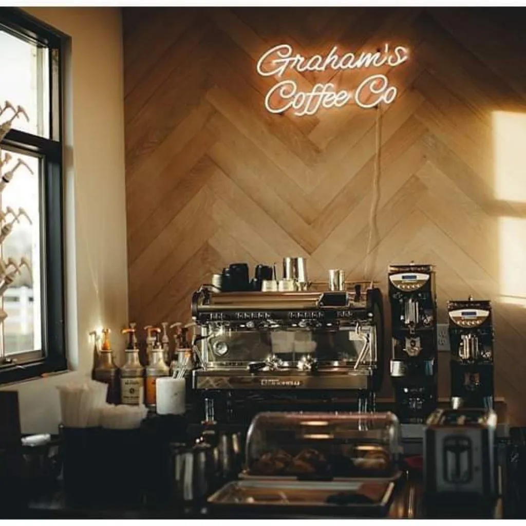 Grahams Coffee Co espresso bar in Gallatin, TN with neon sign and professional coffee equipment.