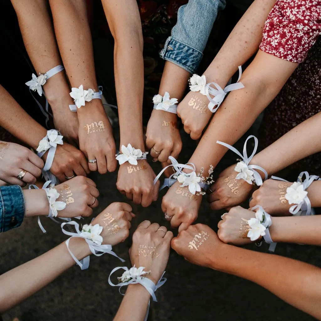 Bride and groom walking through Grahams Estate at sunset