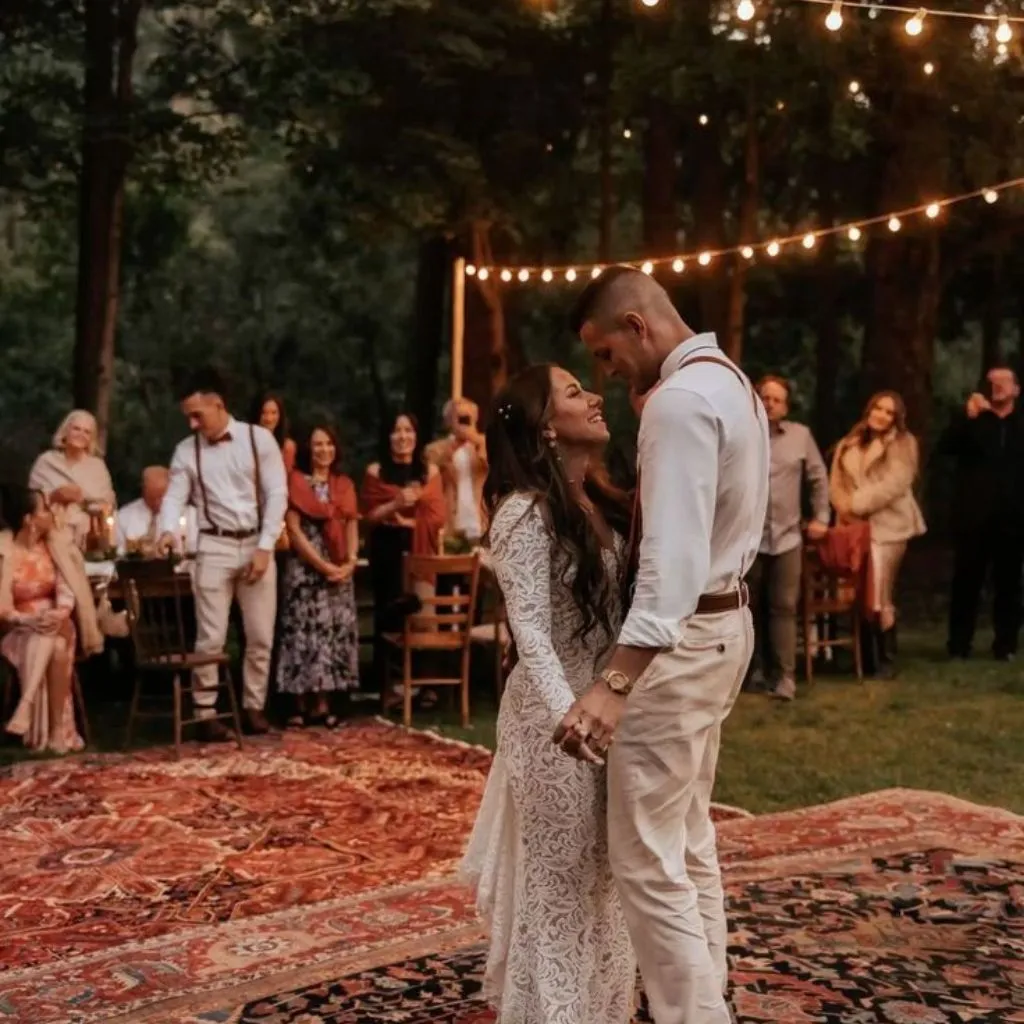 Romantic evening backyard wedding with warm lighting