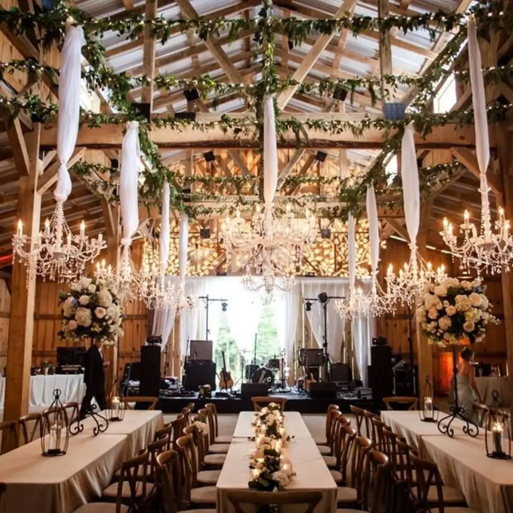 Elegant barn wedding reception with candlelight and rustic-luxe styling