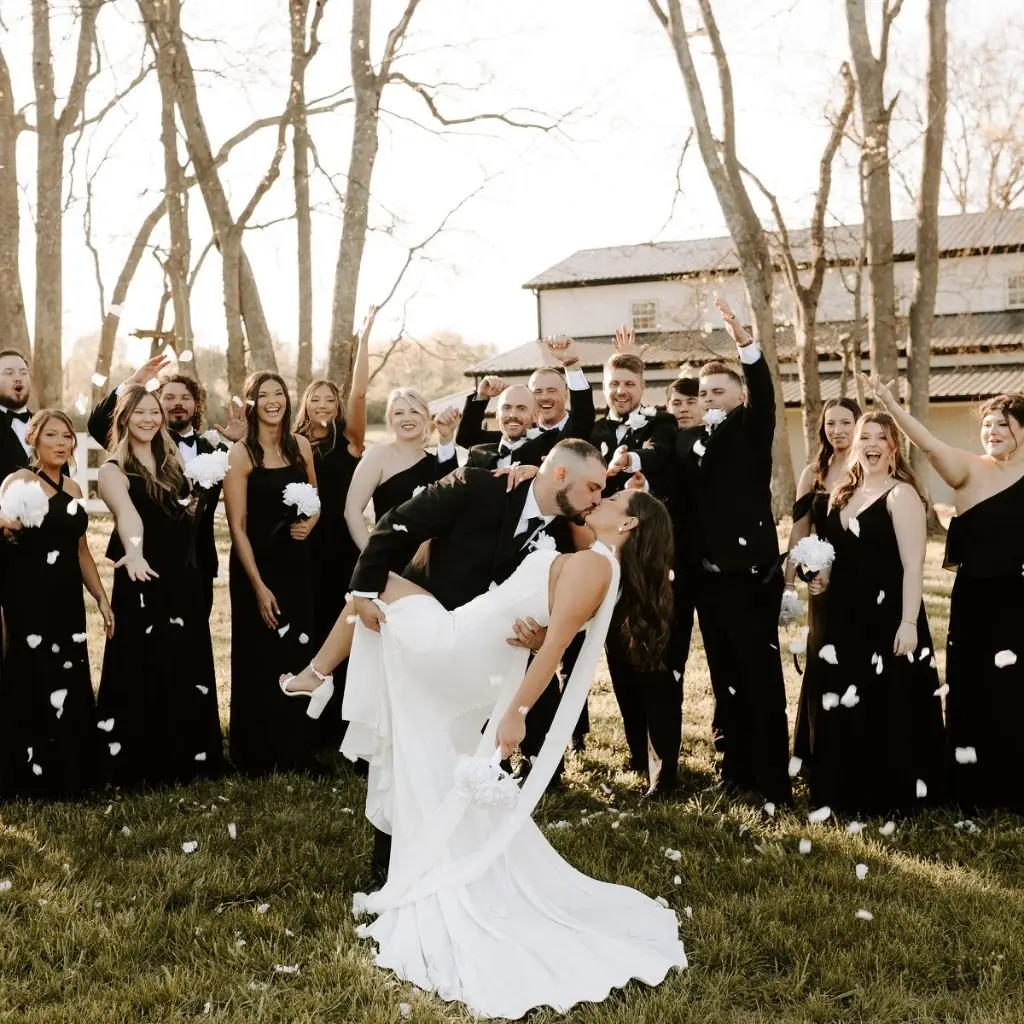 Bride and groom celebrating with their bridal party at Grahams Estate wedding venue in Gallatin TN.