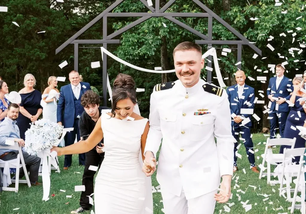 Bride and groom confetti exit after outdoor ceremony at Grahams Estate in Gallatin TN.