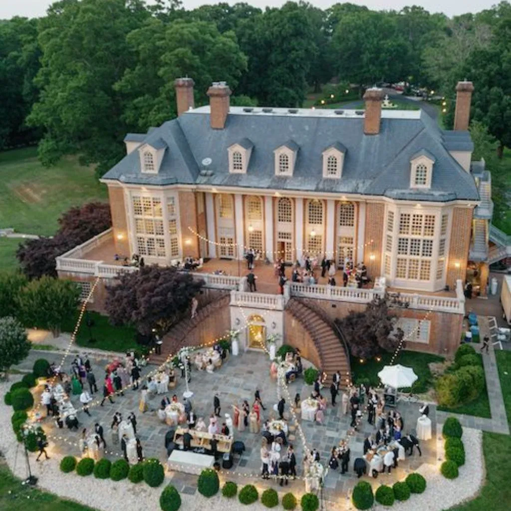 Elegant estate wedding reception with candlelight and historic interior design