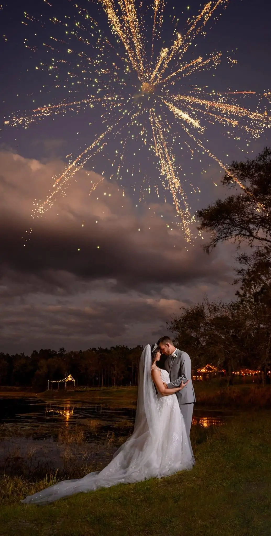 Bride and groom under fireworks during an evening wedding at a Gallatin TN venue