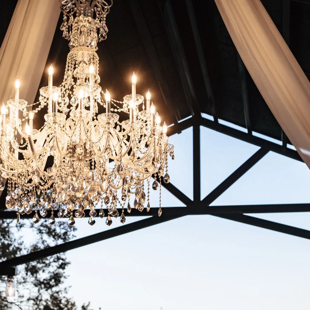 Crystal chandelier hanging in the pavilion at Grahams Estate, a luxury wedding venue in Gallatin Tennessee