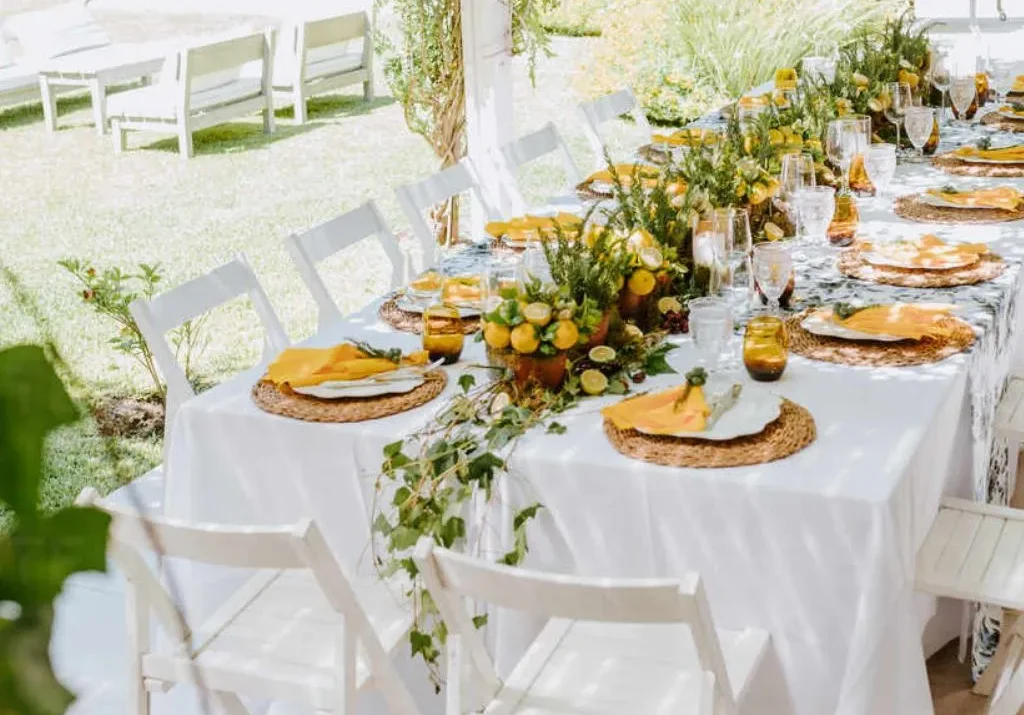 Outdoor wedding reception table decorated with greenery and citrus accents at Grahams Estate in Gallatin Tennessee