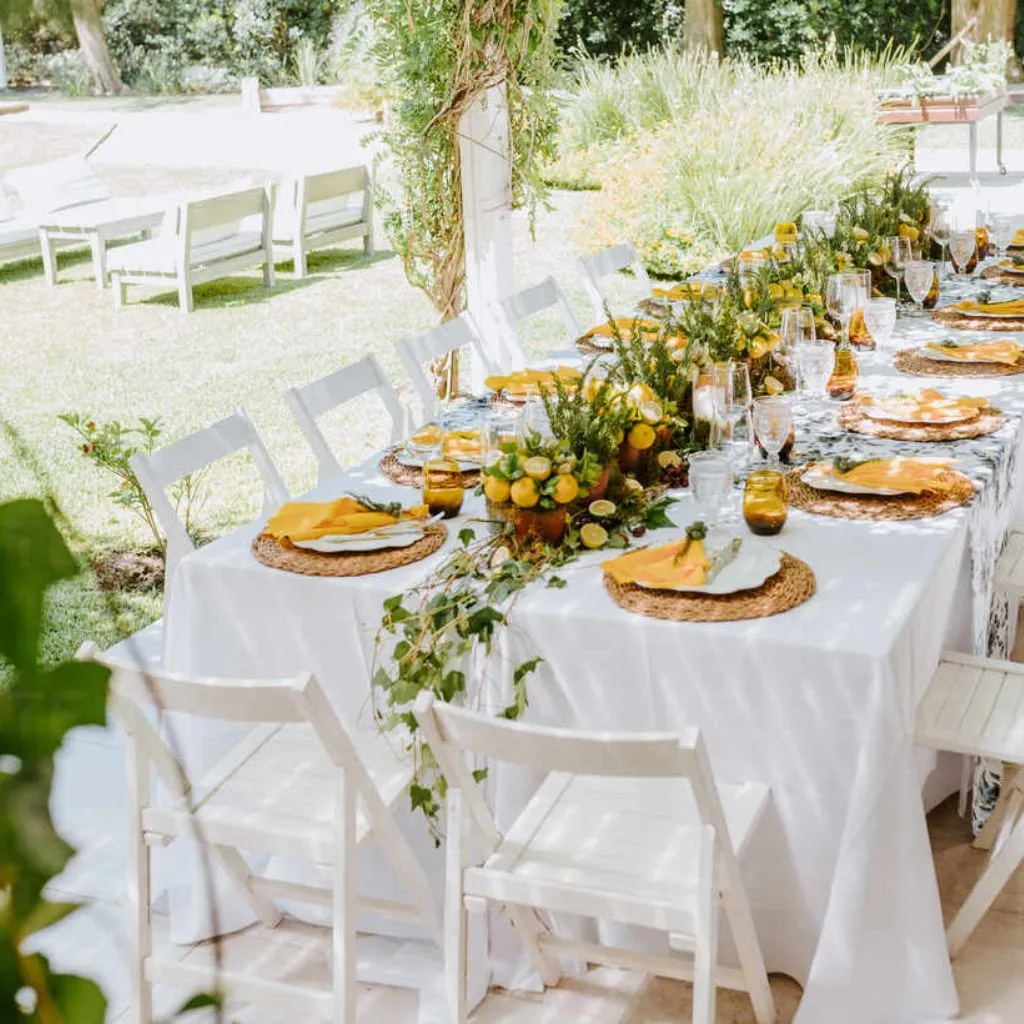 Outdoor wedding reception table decorated with greenery and citrus accents at Grahams Estate in Gallatin Tennessee