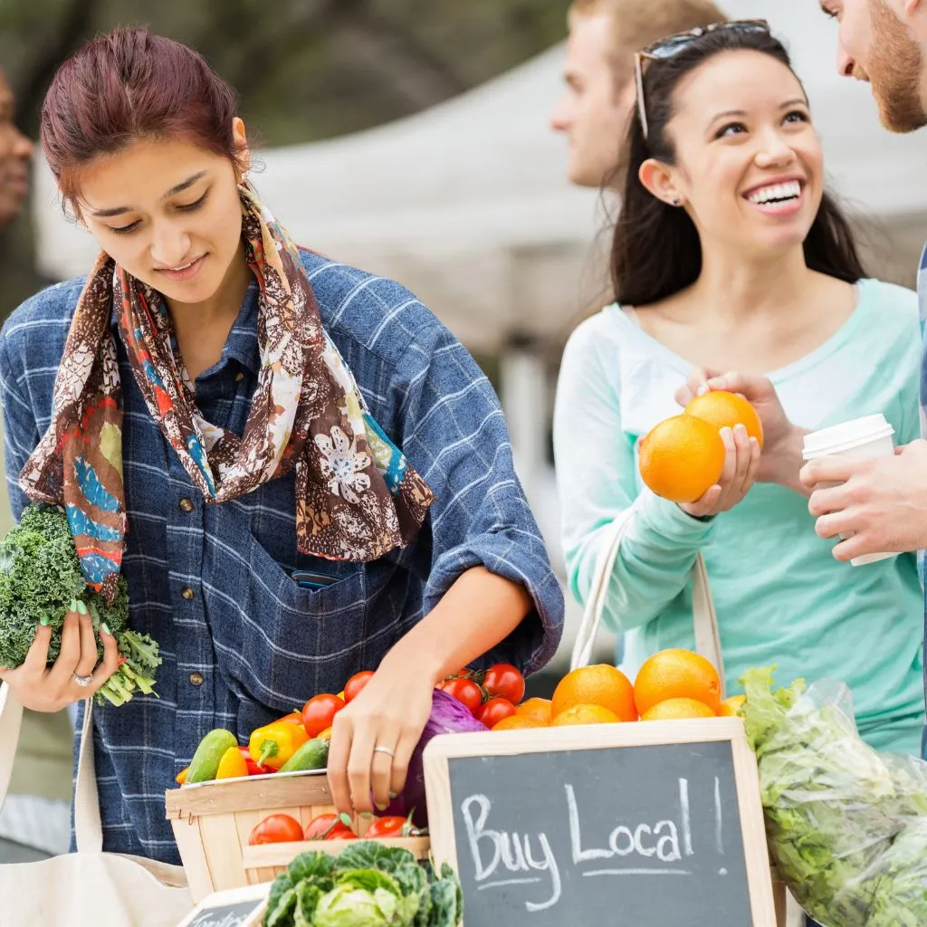 People enjoying brunch and shopping at Nashville Farmers Market in summer