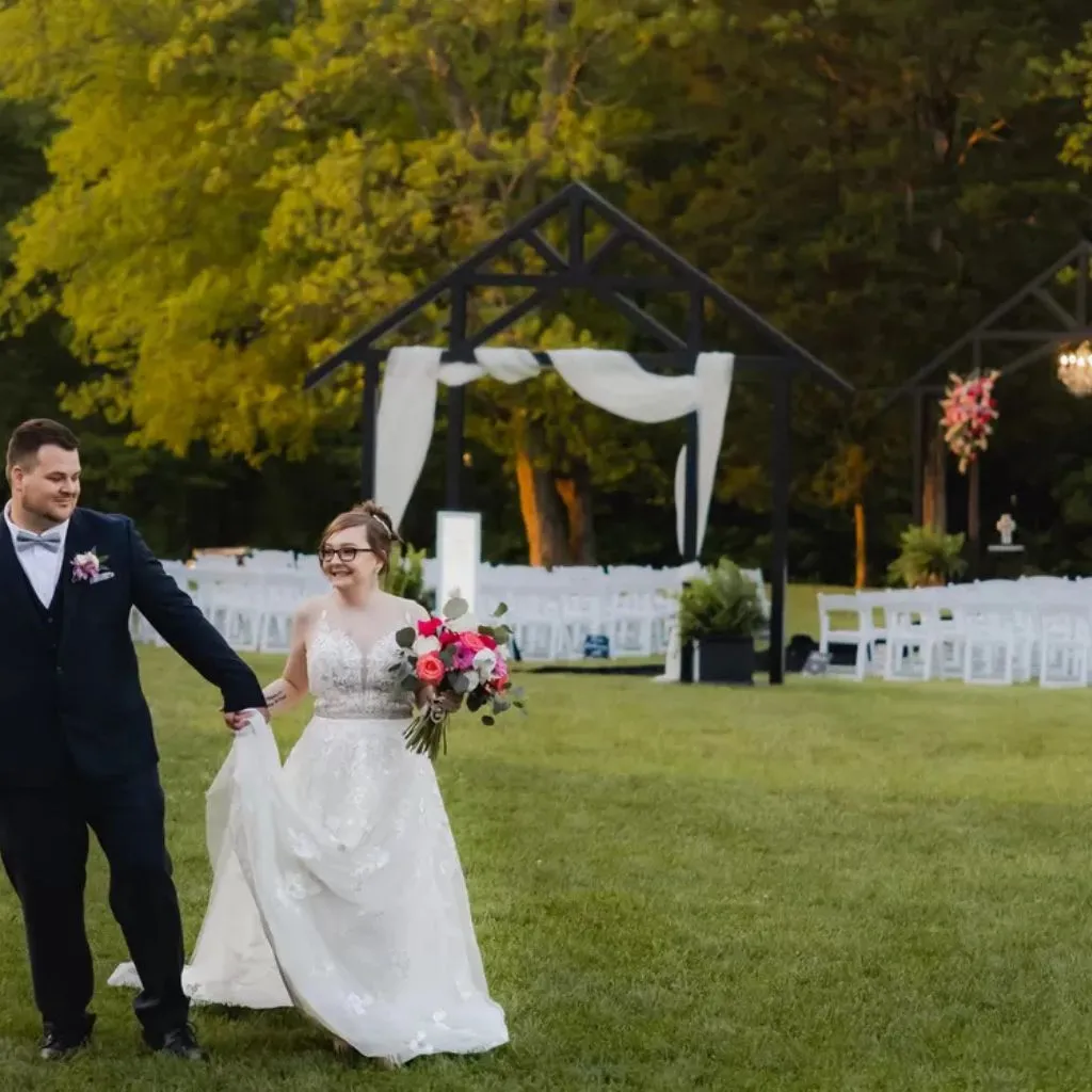 Bride and groom walking after their outdoor ceremony at Grahams Estate in Gallatin TN.