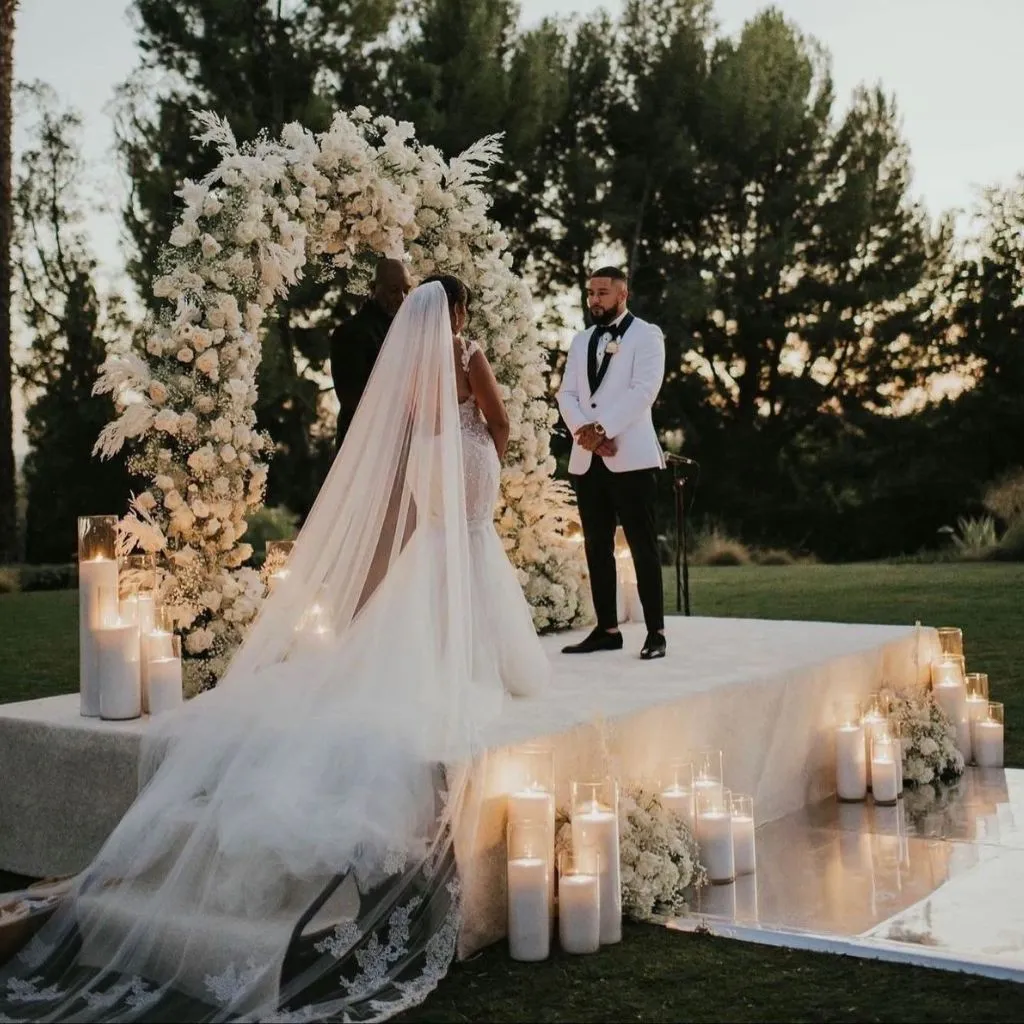 Romantic countryside wedding ceremony with soft florals and natural greenery