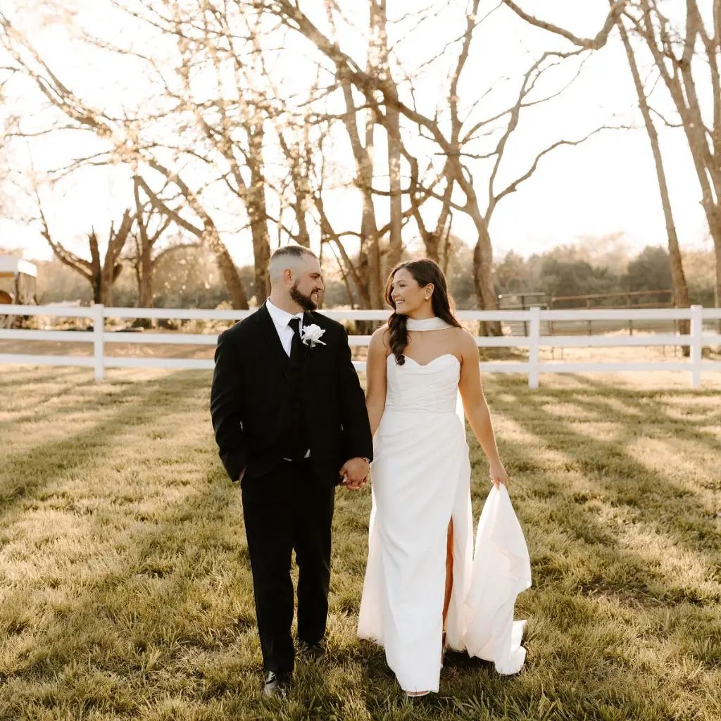 Bride and groom walking at sunset at Grahams Estate wedding venue in Gallatin TN.