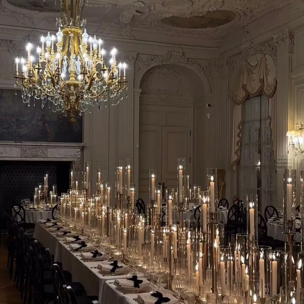 Vintage wedding tablescape featuring antique textures and romantic candlelight