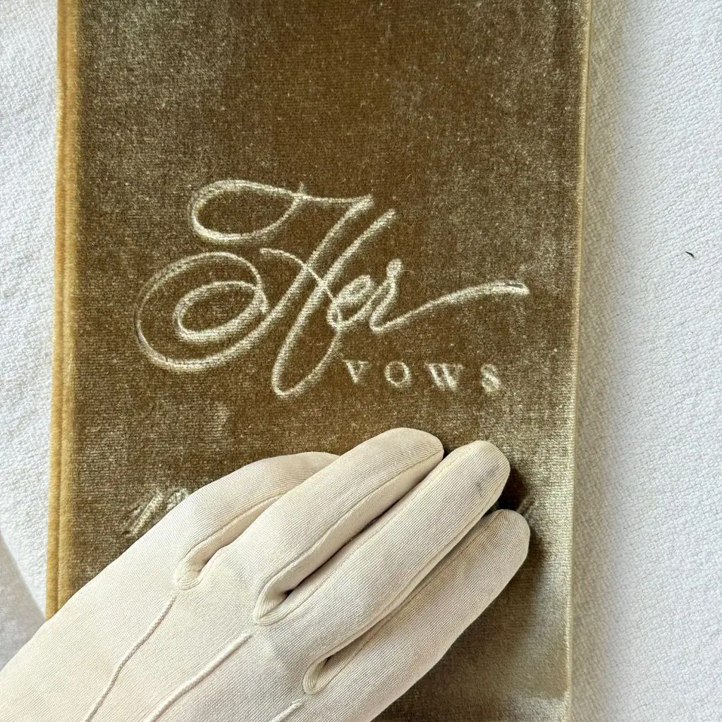 Officiant reading from a personalized wedding script outdoors