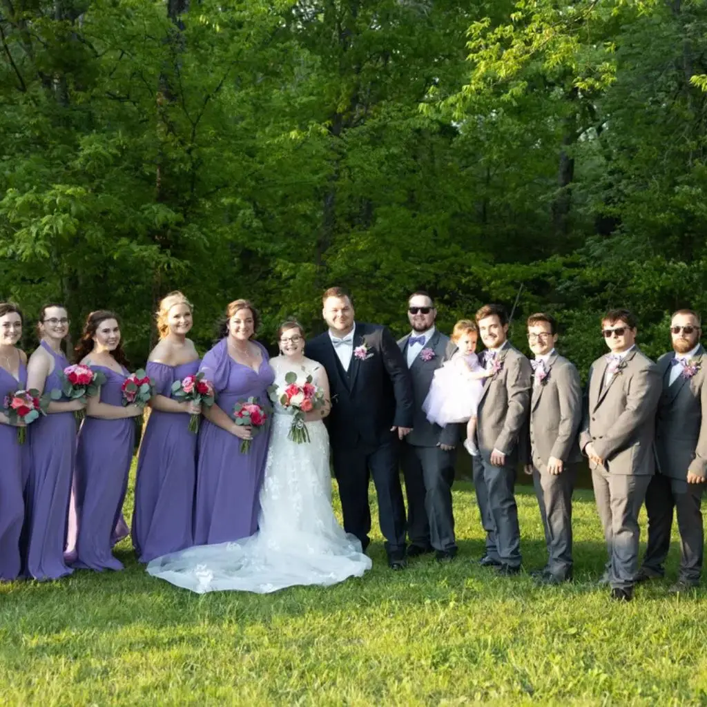 Wedding party posing in lavender dresses at Grahams Estate wedding venue in Gallatin TN.