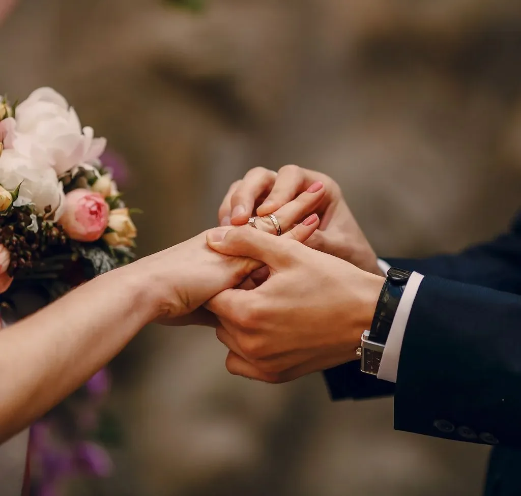 Bride and groom exchanging rings at Grahams Estate wedding venue in Gallatin TN