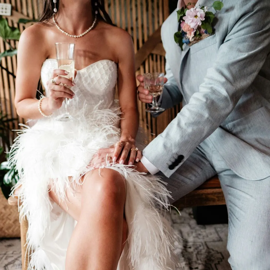 Bride and groom surrounded by their wedding vendor team