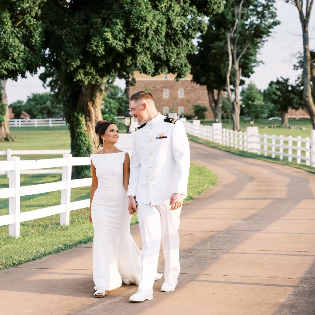 Bride and groom walking along the driveway at a wedding venue in Gallatin TN.