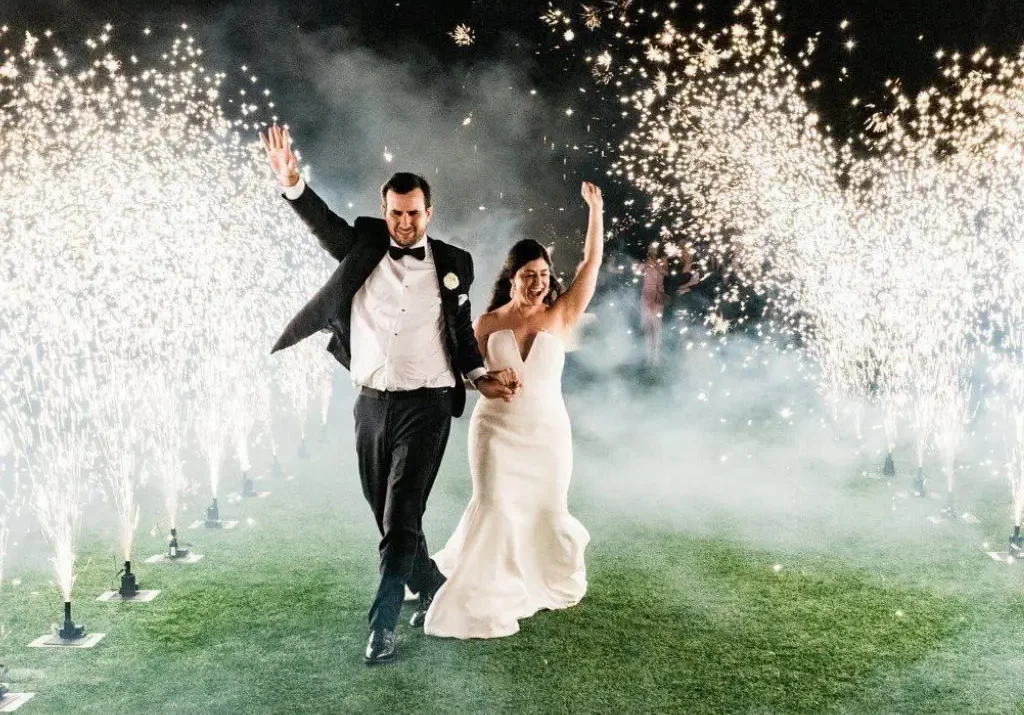 Bride and groom running through a sparkler exit at a wedding venue in Gallatin TN.