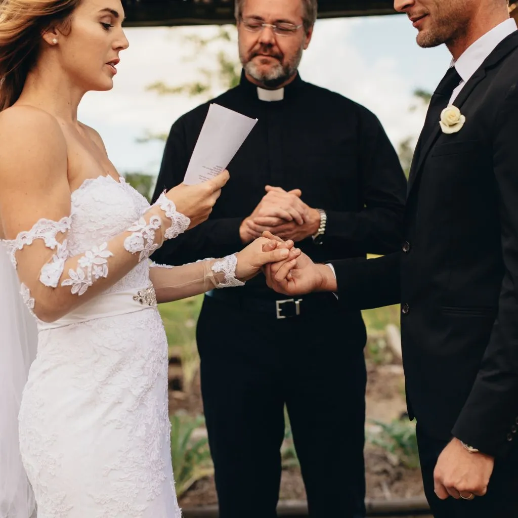 Couple exchanging vows during an emotional outdoor wedding ceremony